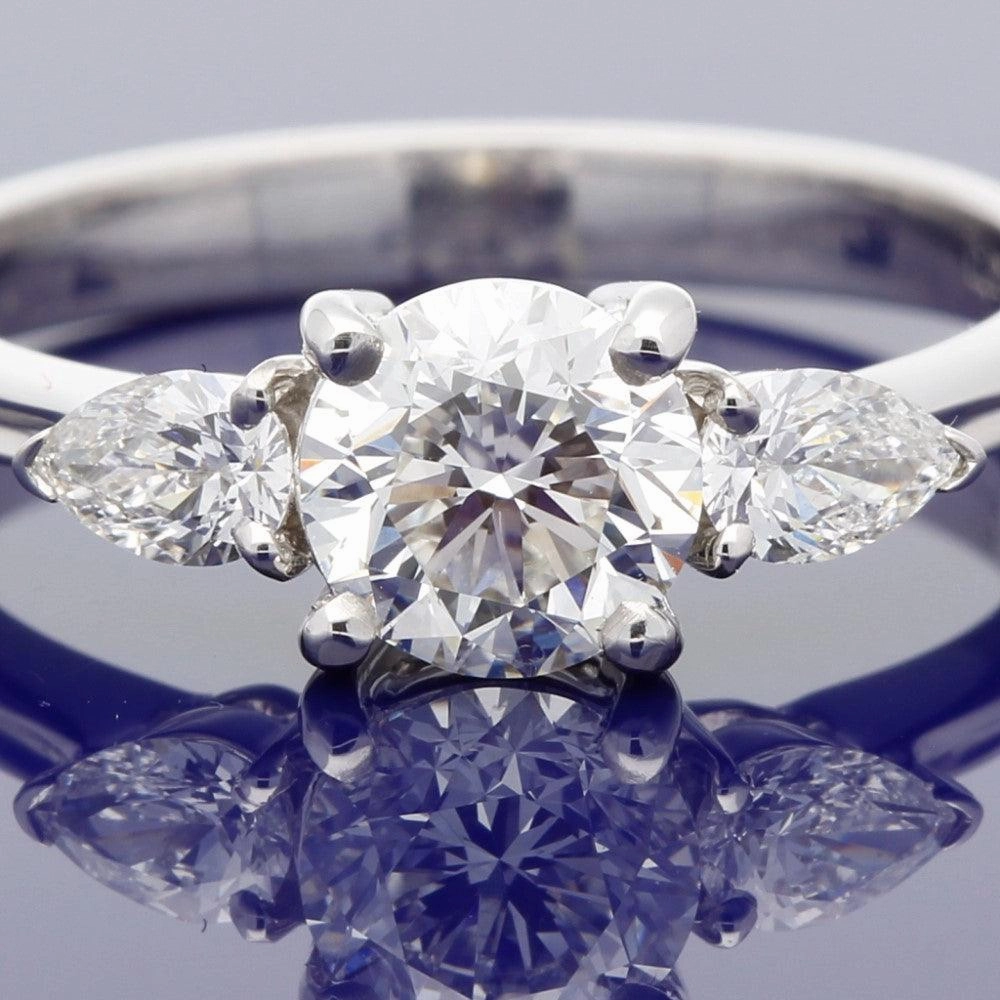 18ct White Gold Certificated 0.90ct Diamond Trilogy Ring with Pear Shape Diamond Set Shoulders