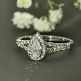 18ct White Gold Certificated Pear Cut Diamond Halo Ring