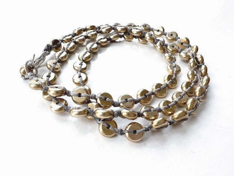 ANN LIGHTFOOT - INTERMITTENT BRASS DISK BRAIDED WRAP BRACELET