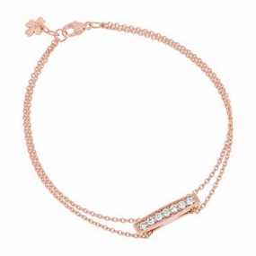 Bracelet en or rose serti de diamants.
