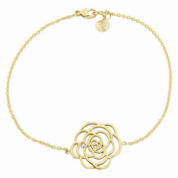 Bracelet fleur en or jaune serti d'un diamant.