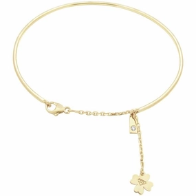 Bracelet jonc et chainette en or jaune serti d'un diamant
