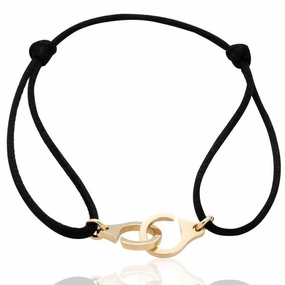 Bracelet menottes en or jaune , cordon satin.