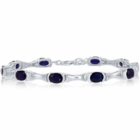Classic Women's Bracelet - 7x5 mm Oval and Blue Diffusion Sapphire Tennis | T-7574