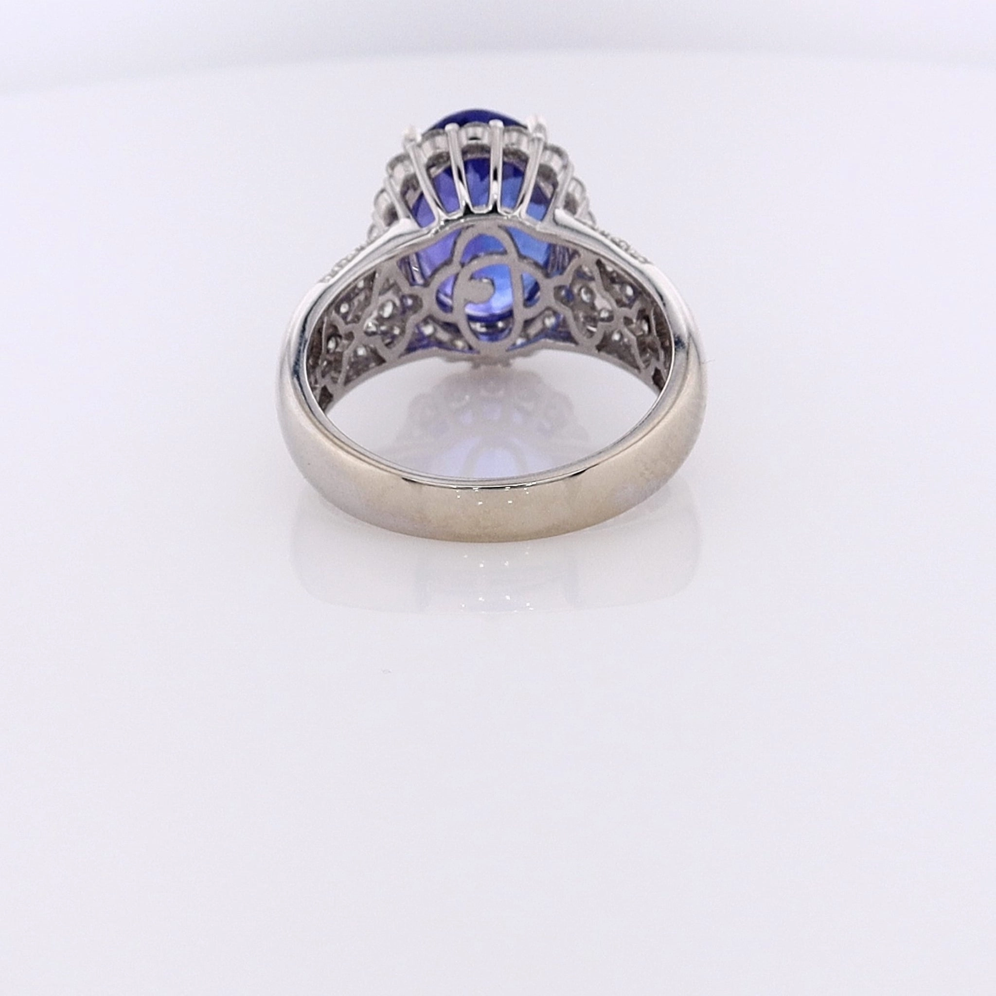 Estate 14 Karat White Gold Tanzanite Ring with Diamond Halo and Shank