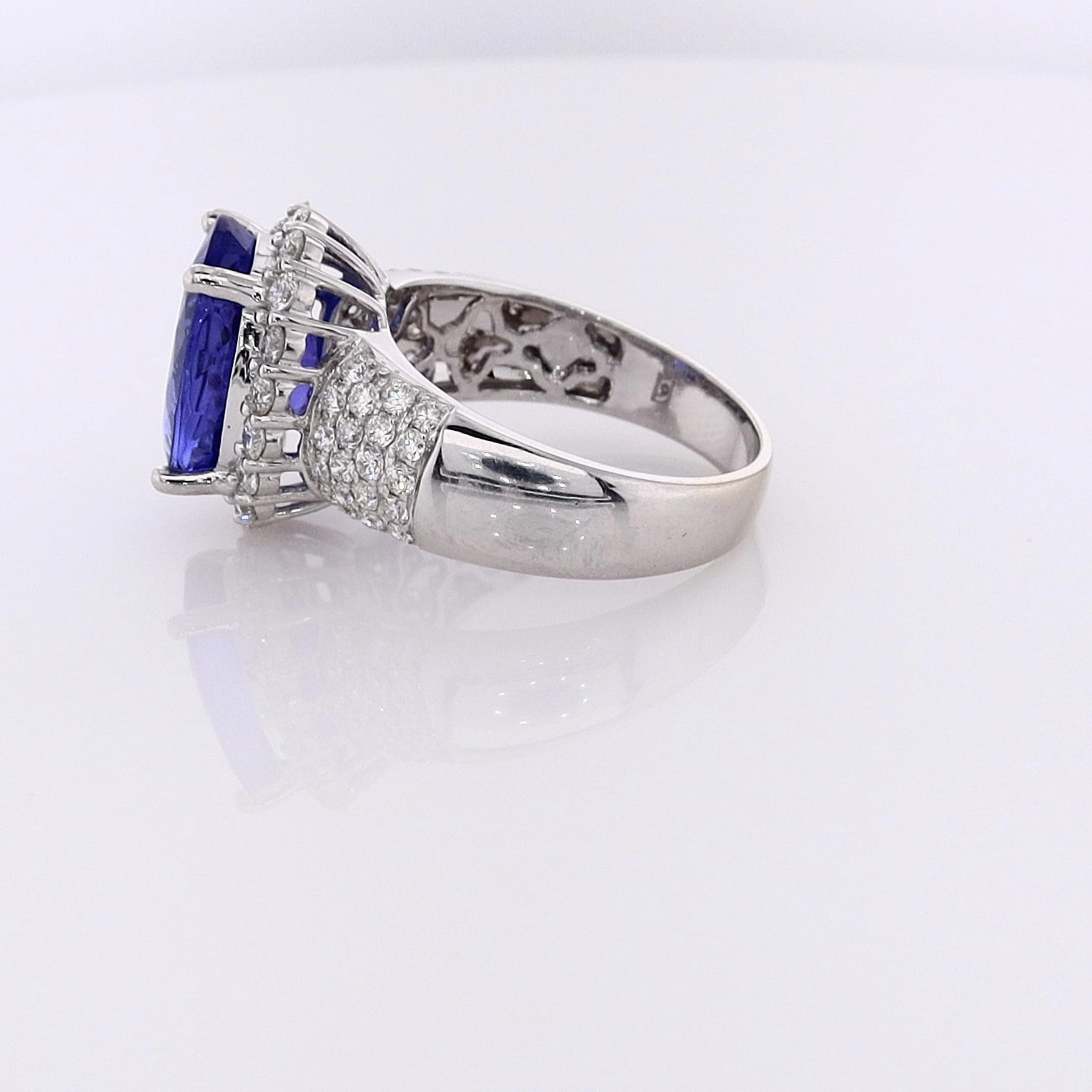 Estate 14 Karat White Gold Tanzanite Ring with Diamond Halo and Shank