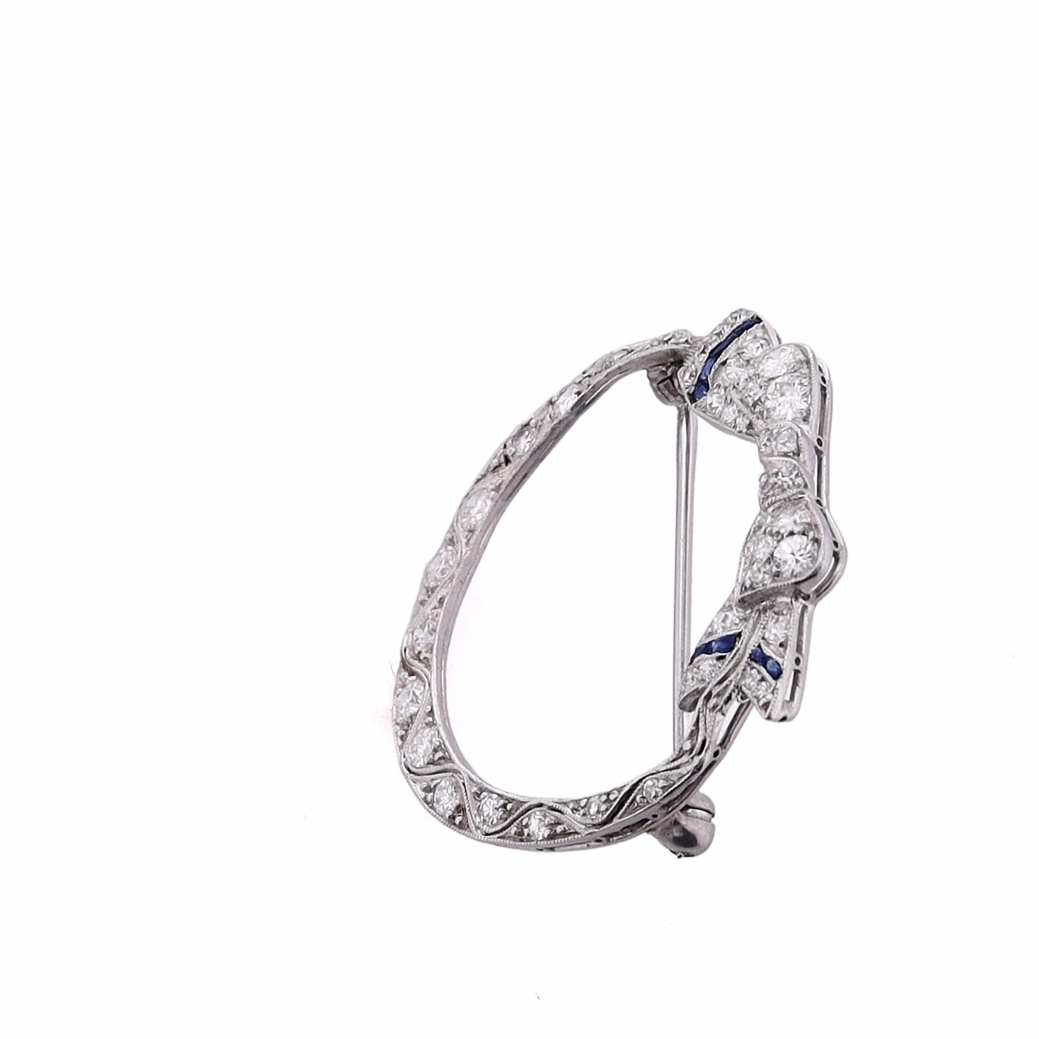 Estate Platinum Bow Design Diamond and Synthetic Sapphire Circle Pin