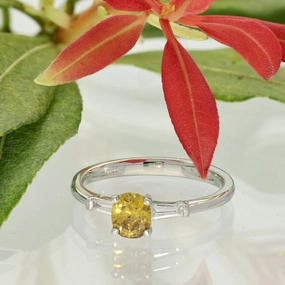 Platinum 0.54ct Natural Yellow Diamond Solitaire Ring with Baguette Shoulders