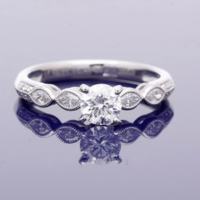 Platinum 0.56ct Solitaire with Diamond Set Shoulders Ring