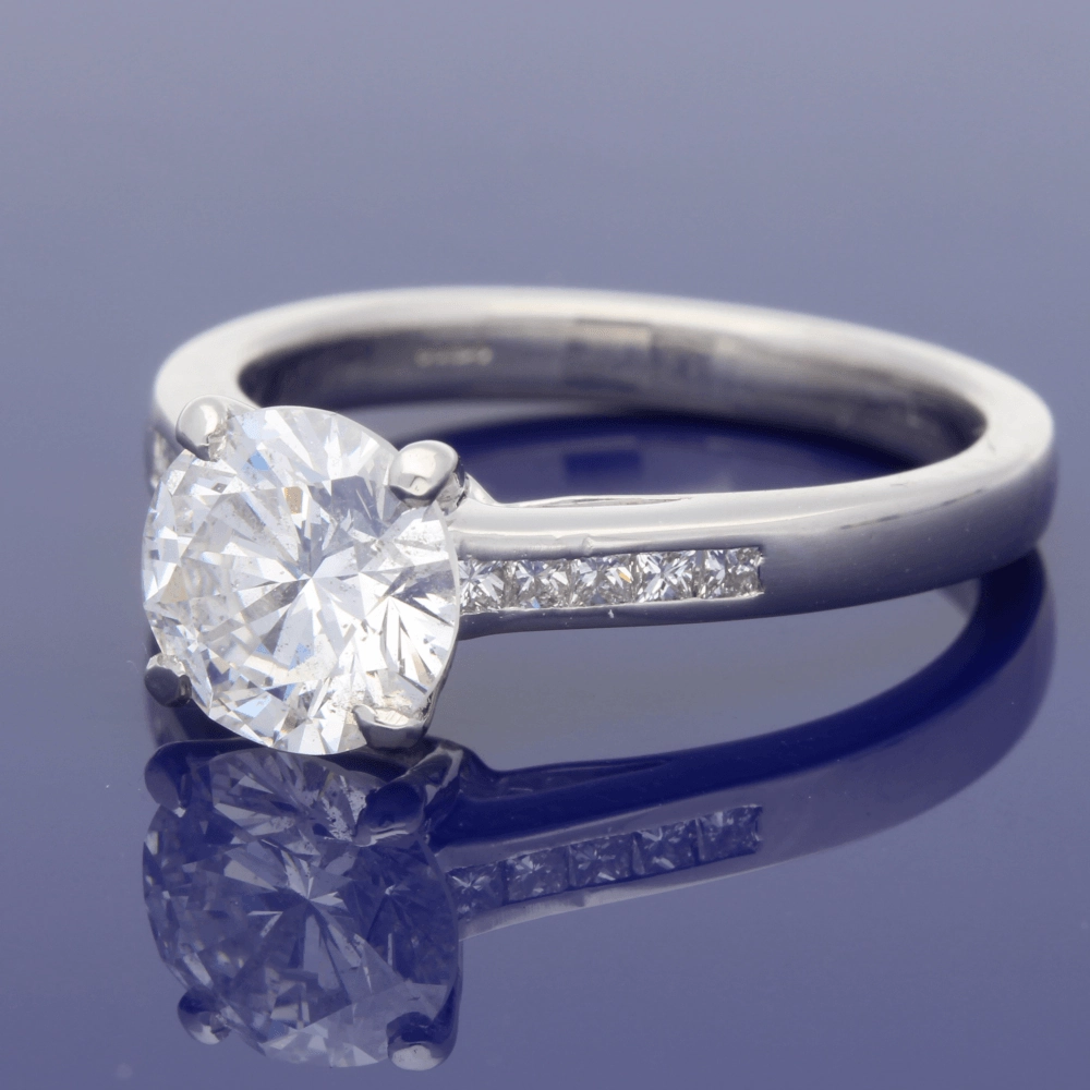 Platinum 1.50ct Round Diamond & Princess Cut Diamond Set Shoulders Ring