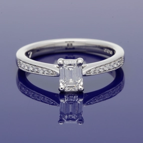 Platinum Certificated 0.53ct Emerald Cut Solitaire Ring with Diamond Shoulders