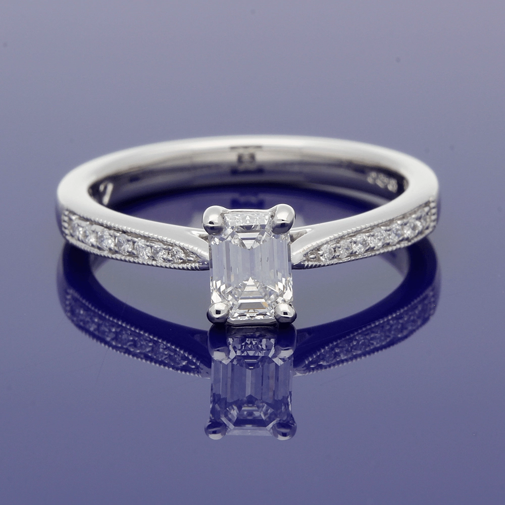Platinum Certificated 0.53ct Emerald Cut Solitaire Ring with Diamond Shoulders