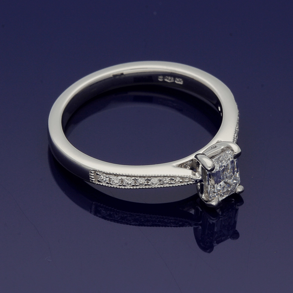 Platinum Certificated 0.53ct Emerald Cut Solitaire Ring with Diamond Shoulders