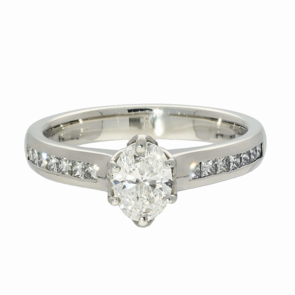 Platinum Certificated 0.70ct Oval Diamond Solitaire Ring with Princess Cut Shoulders