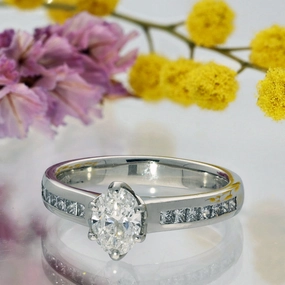 Platinum Certificated 0.70ct Oval Diamond Solitaire Ring with Princess Cut Shoulders