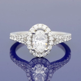 Platinum Certificated Oval Cut Diamond Halo Ring with Diamond Set Shoulders