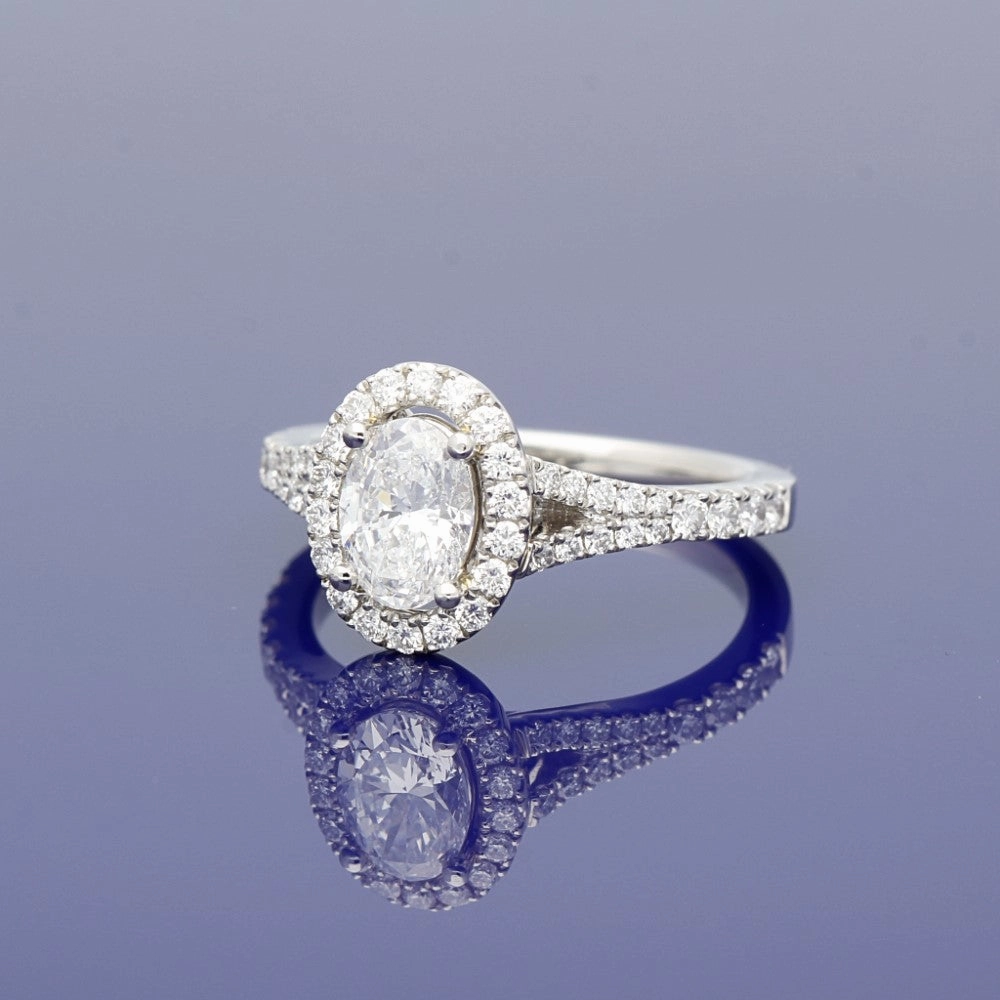 Platinum Certificated Oval Cut Diamond Halo Ring with Diamond Set Shoulders