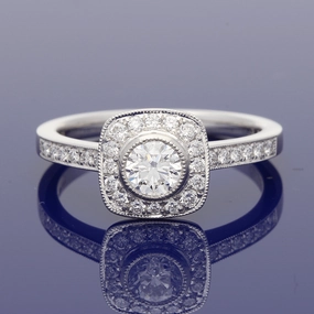 Platinum Diamond Halo Ring with Diamond Set Shoulders
