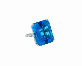 Platinum ring set with diamond and blue Topaz