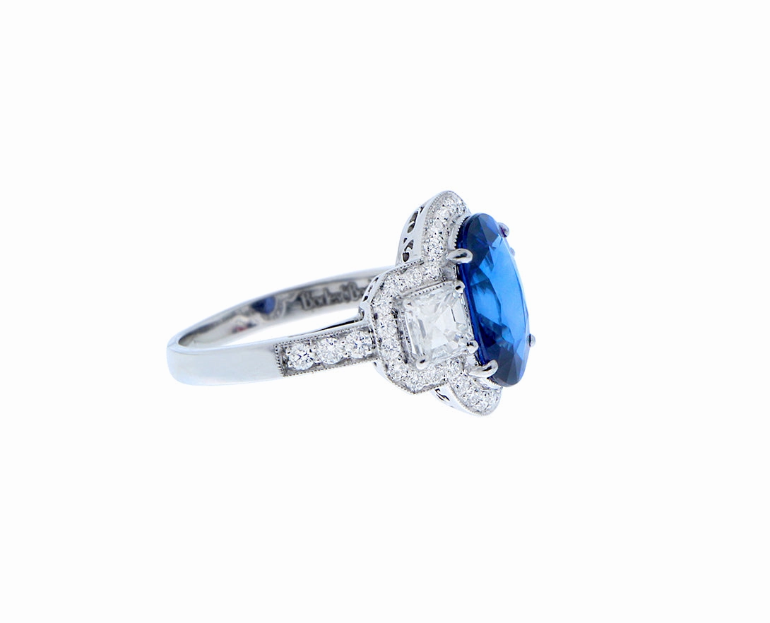 Platinum ring with diamonds and sapphire