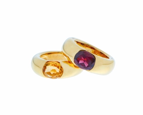 Yellow gold Cartier Ellipse ring with citrine or garnet. Price per ring