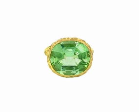 Yellow gold hammered ring with a light green tourmaline