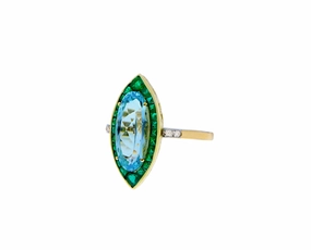 Yellow gold ring with a blue topaz, emeralds and diamonds