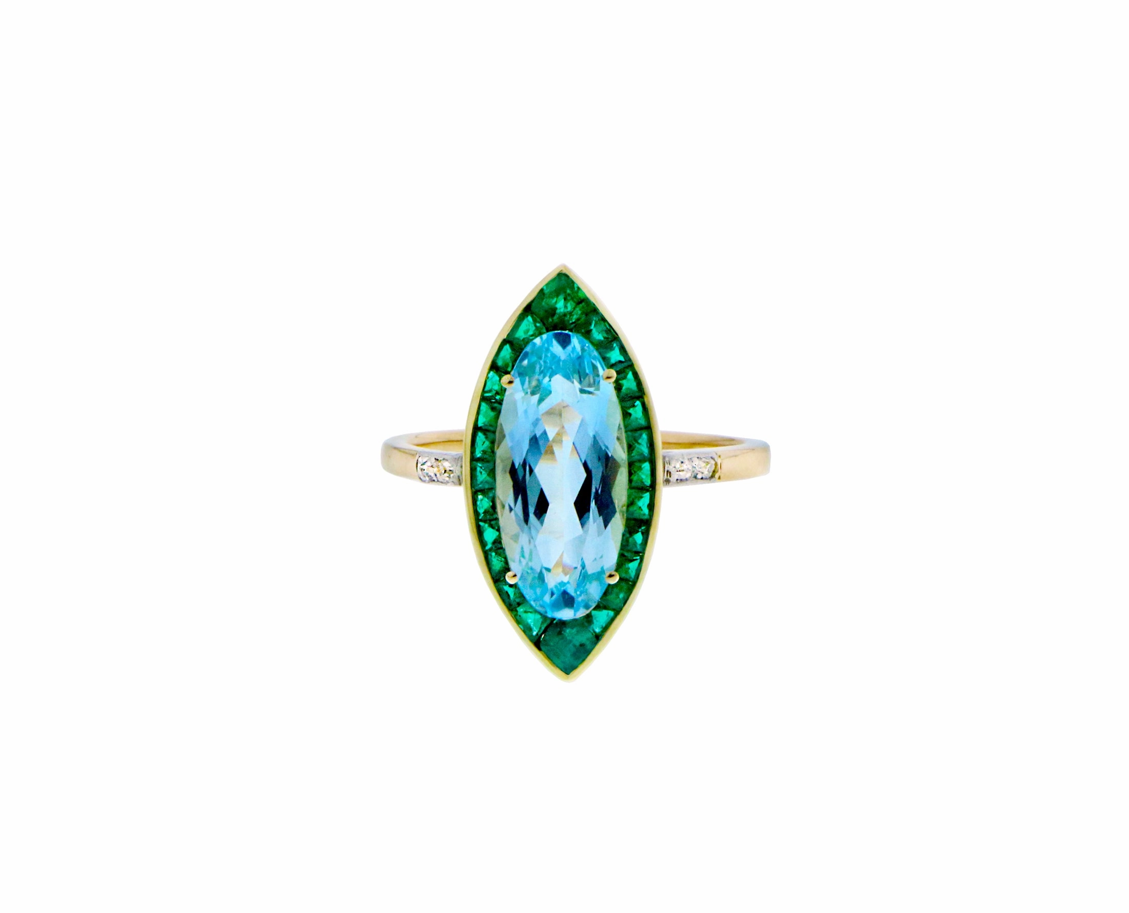 Yellow gold ring with a blue topaz, emeralds and diamonds