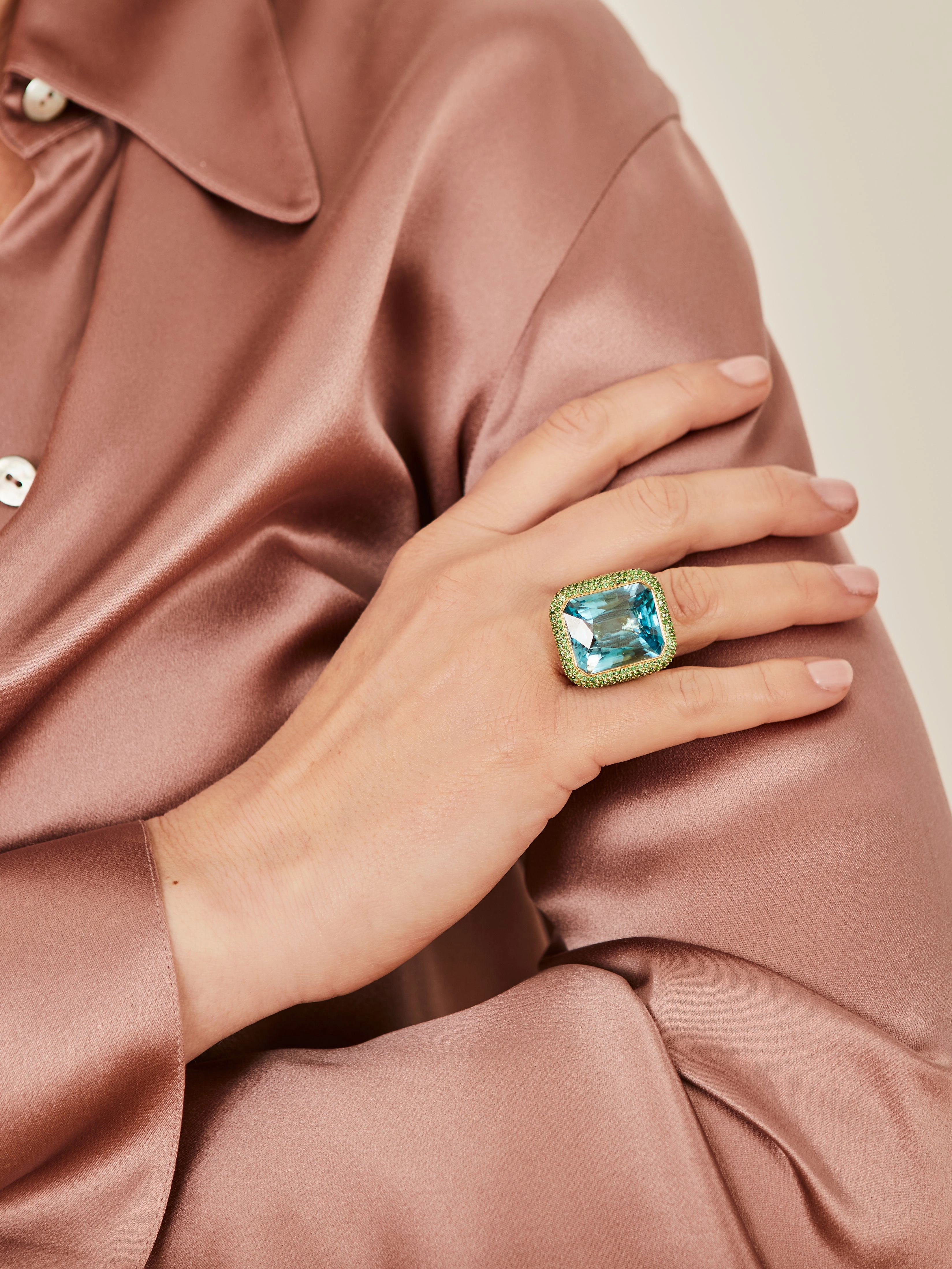 Yellow gold ring with a blue zircon and tsavorites