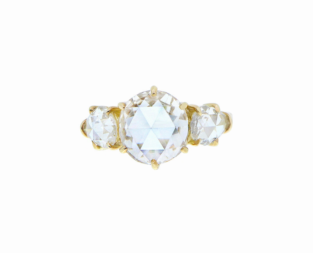 Yellow gold ring with a rose cut diamond and two pear shaped rose cut diamonds