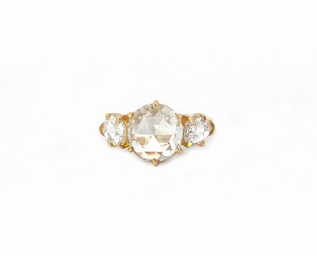 Yellow gold ring with a rose cut diamond and two pear shaped rose cut diamonds