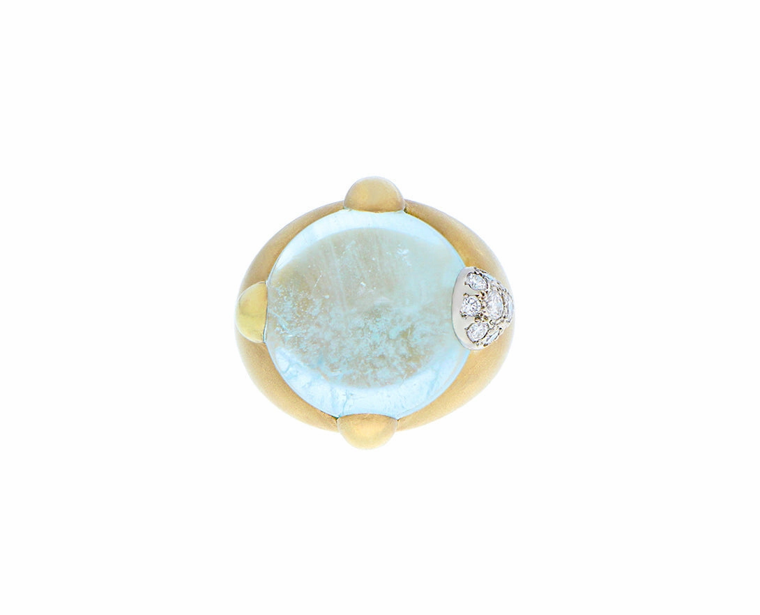 Yellow gold ring with a round cabochon cut aquamarine and diamonds