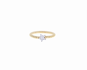 Yellow gold tubo ring with a diamond star
