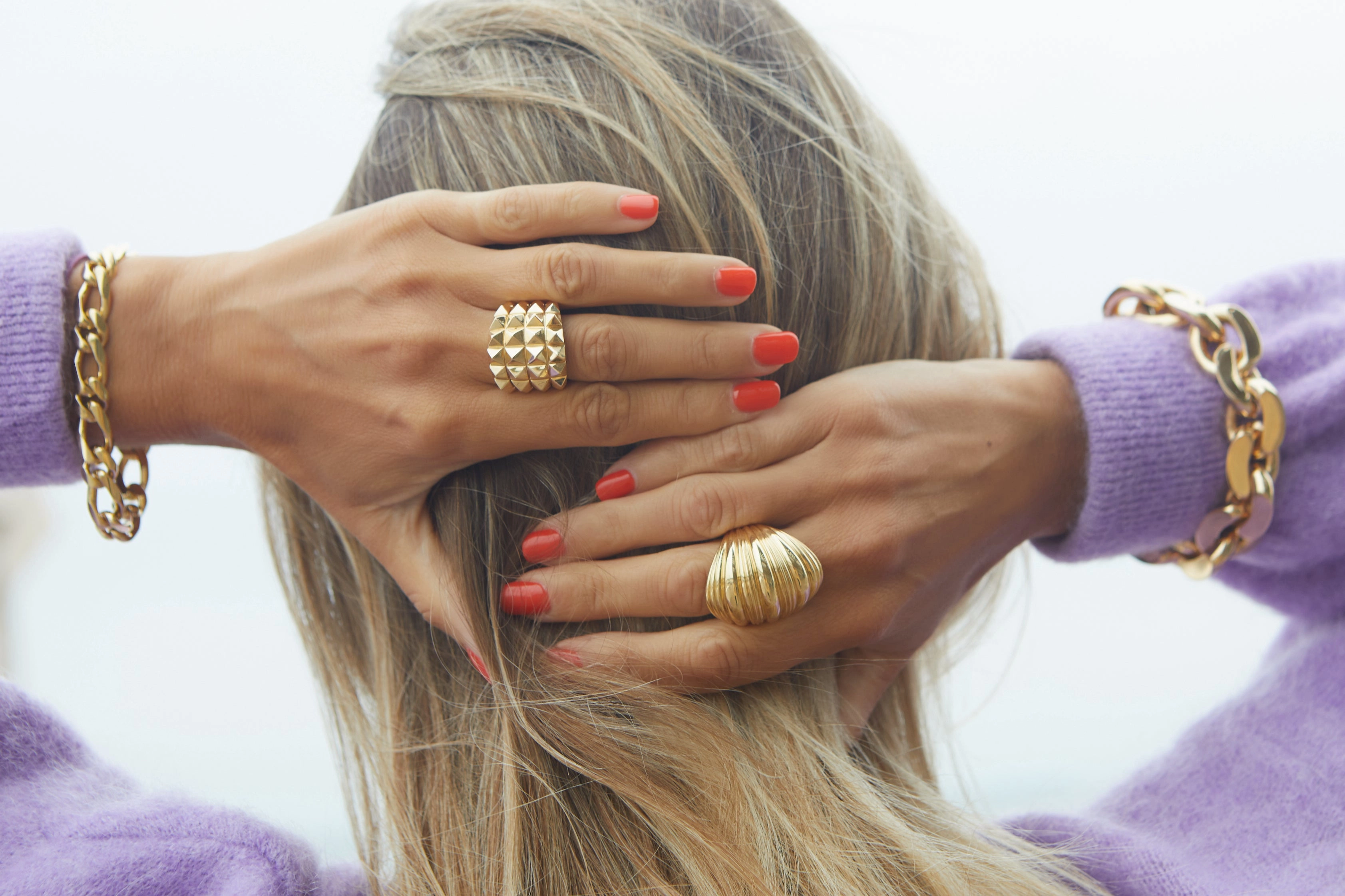 Yellow or rose gold ring with four rows of studs