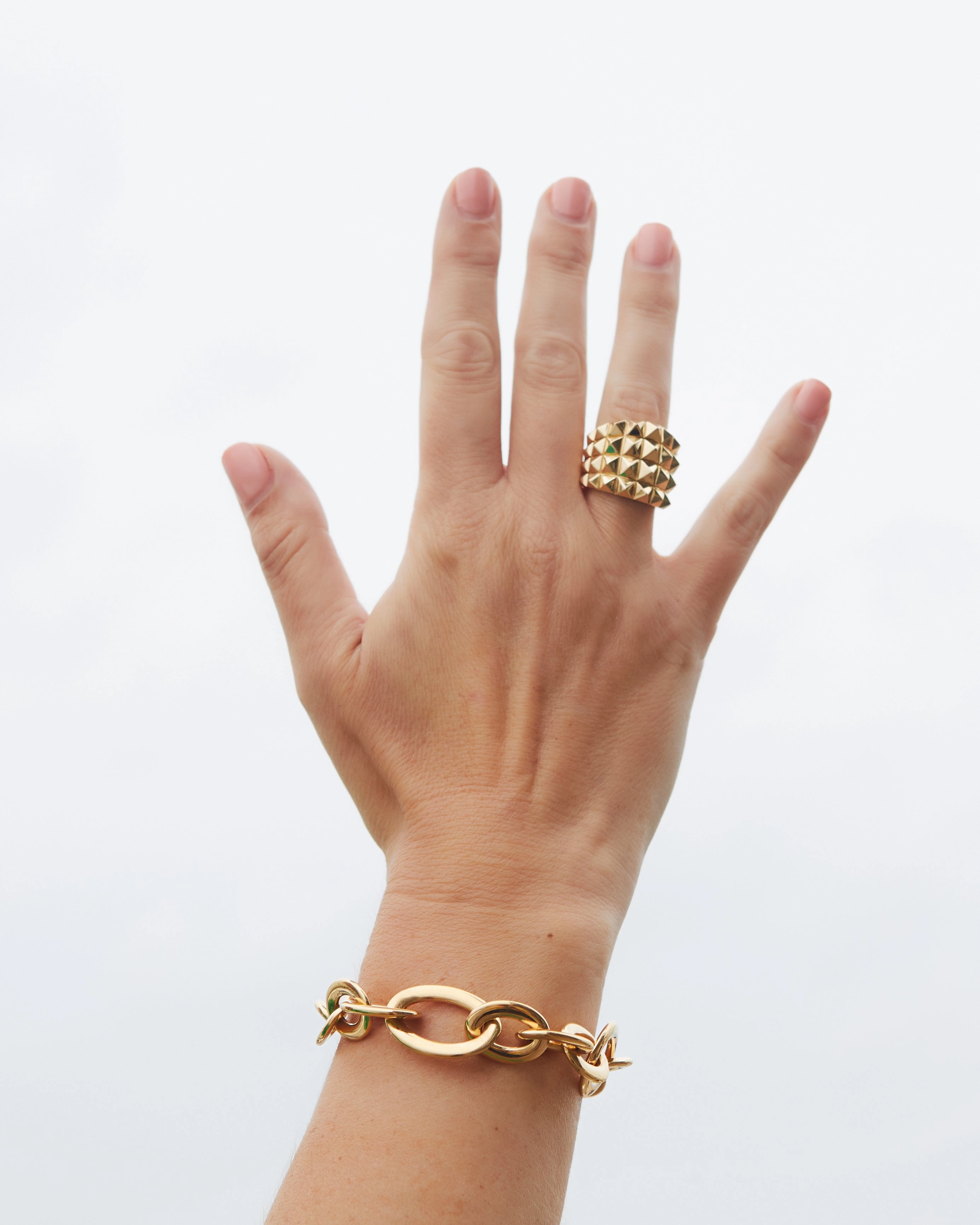 Yellow or rose gold ring with four rows of studs